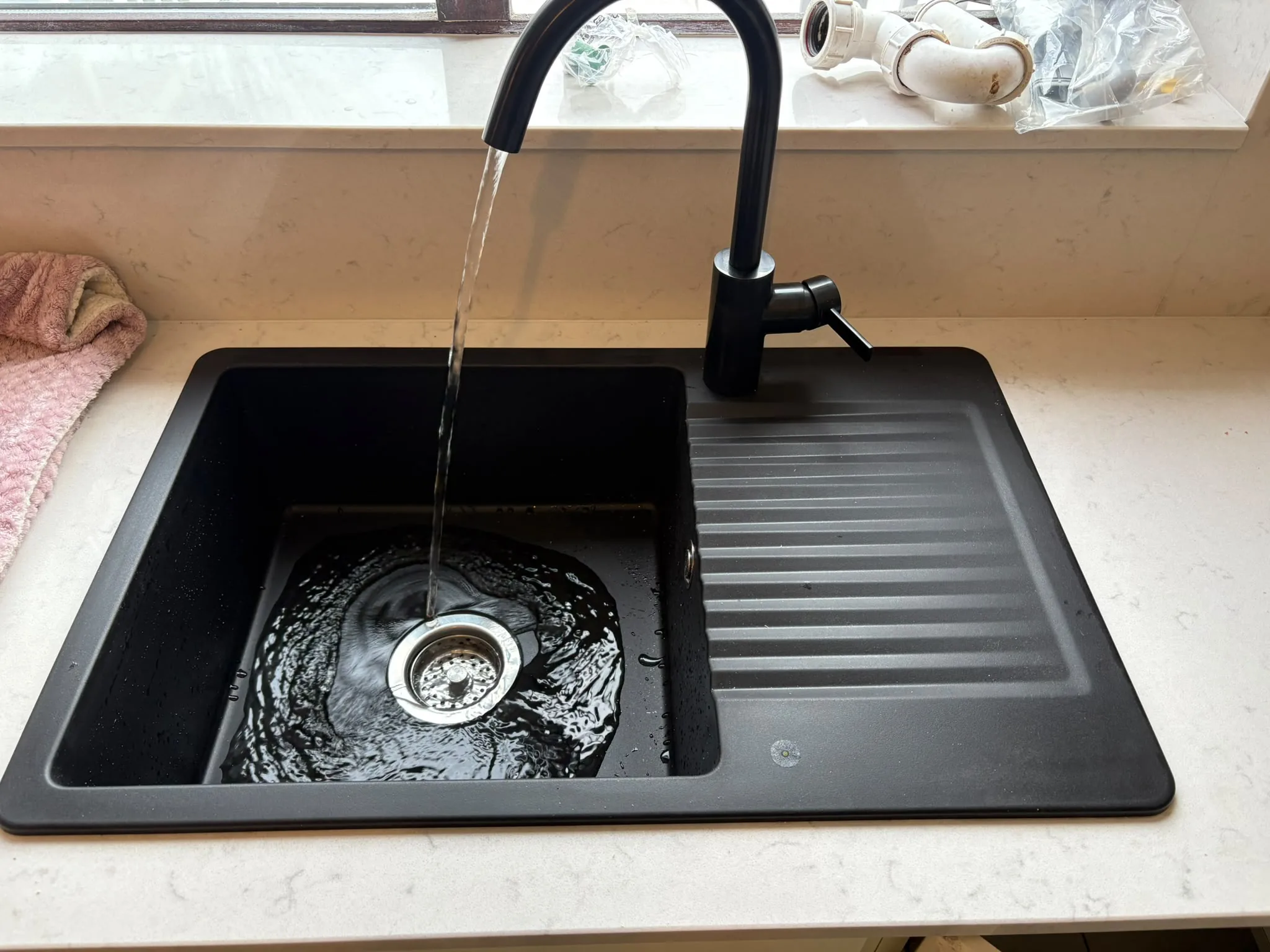 Black kitchen sink and tap fitted by LMN Plumbing in Sligo