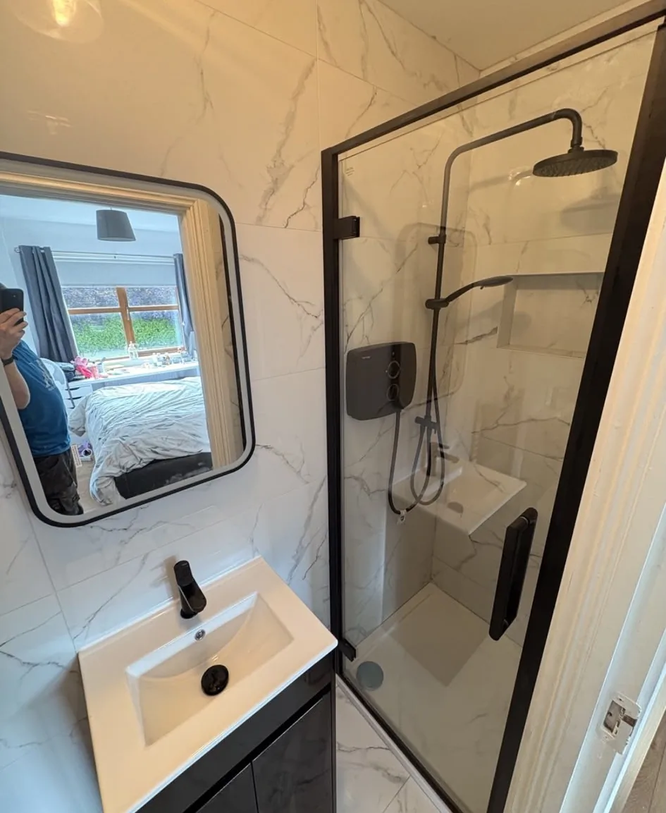 Black shower enclosure and vanity fitted in a Sligo bathroom